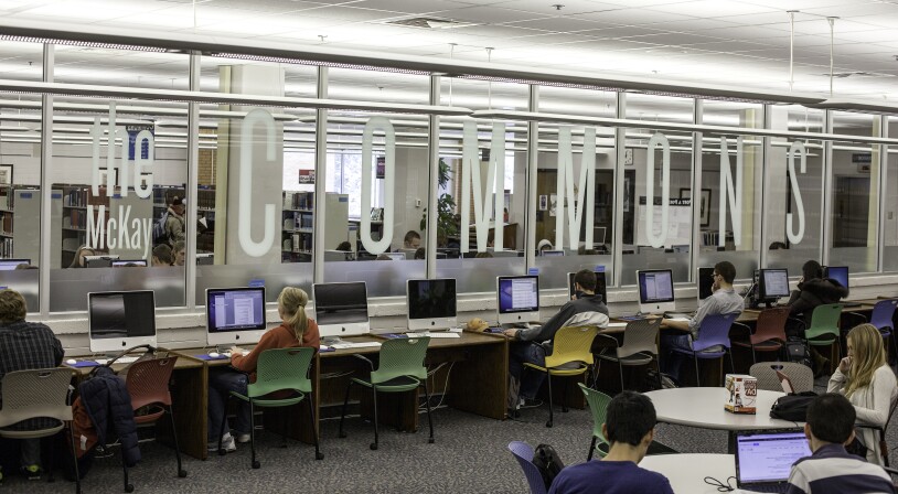 Students sitting at computers in the Mckay Library Mac Lab.