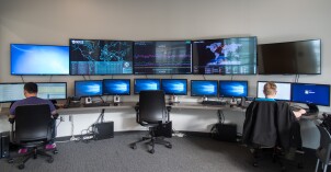 Students work in the Cyber Security room in the STC building.