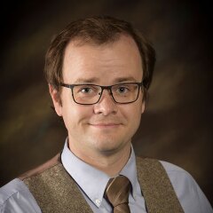 A portrait photo of Samuel Head