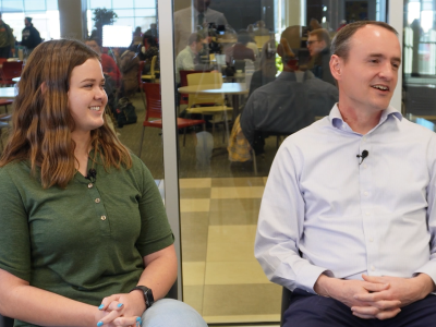 Jade Ford and Nathan Jack smile as they talk.