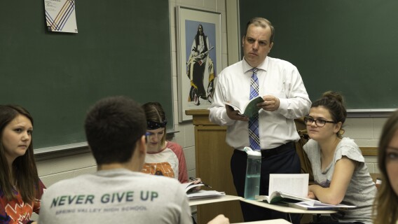 Students and a professor in a Literary Interpretation Class discuss a novel.