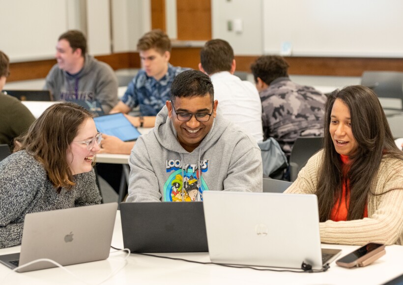 Students work on computers while in the classroom