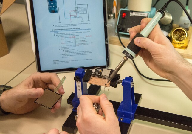 Students using a soldering iron