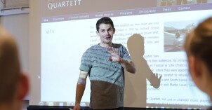 A student gives a presentation in front of a Humanities Class.