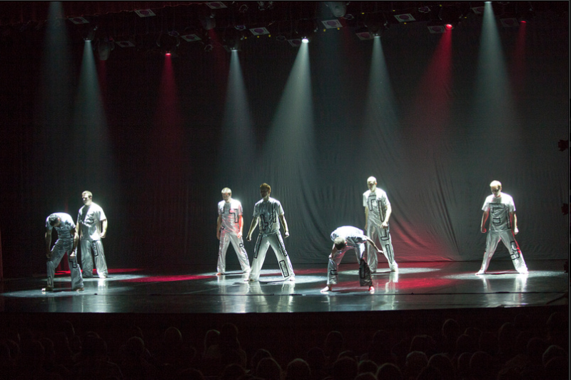 Dancers perform on stage