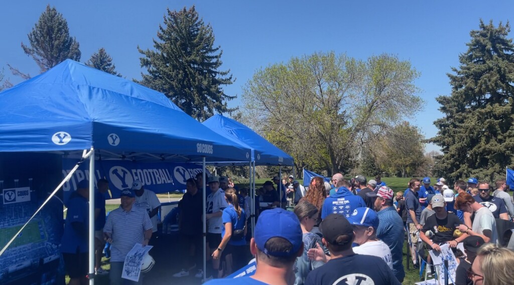 Fans wait in a long line to meet BYU Football Players, and Coach Sitaki
