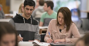 A tutor helps a student study for class