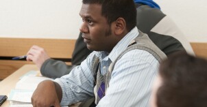 A BYU-Idaho student listens with great interest in a political science foreign affairs class