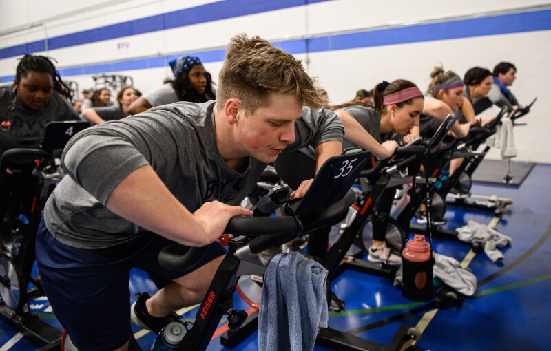 A indoor cycling class held in the Hart fitness center.