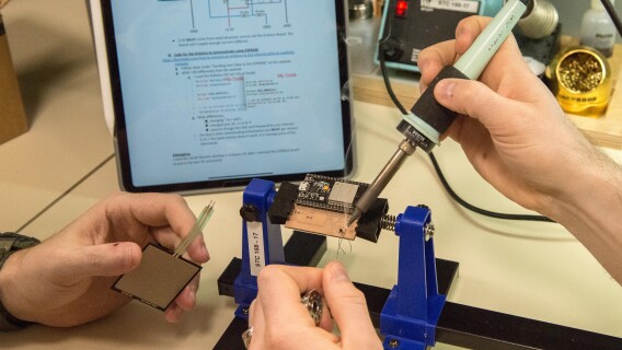 Students using a soldering iron