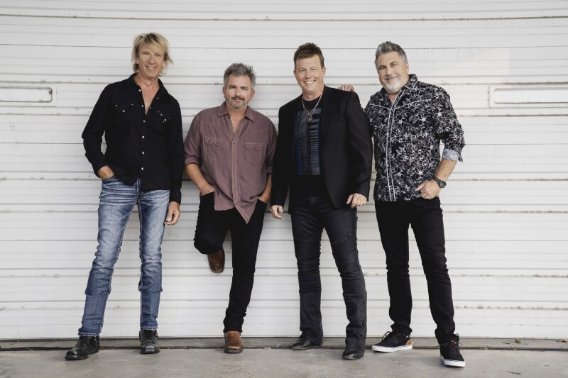 4 men from the music group Lonestar standing together.