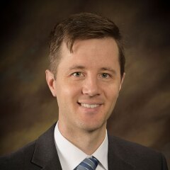 A portrait photo of Andrew Wells