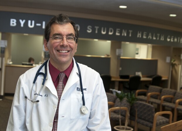 Dr. Andy Bradbury poses smiling in the Student Health Center.