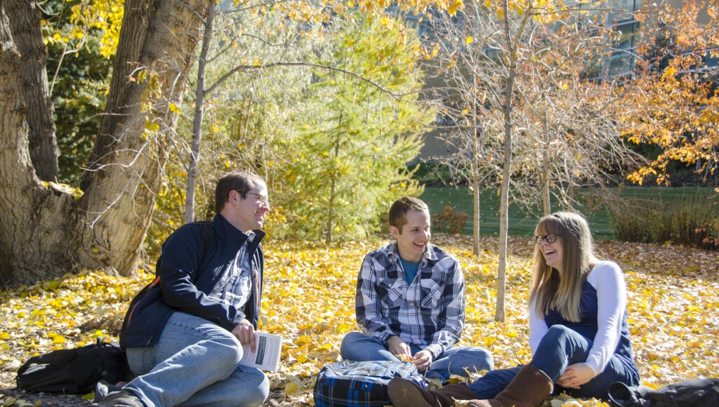 Hans Stokes, Devin Pyle, & Jenn Pyle chat & study during fall semester near the Ricks Building
